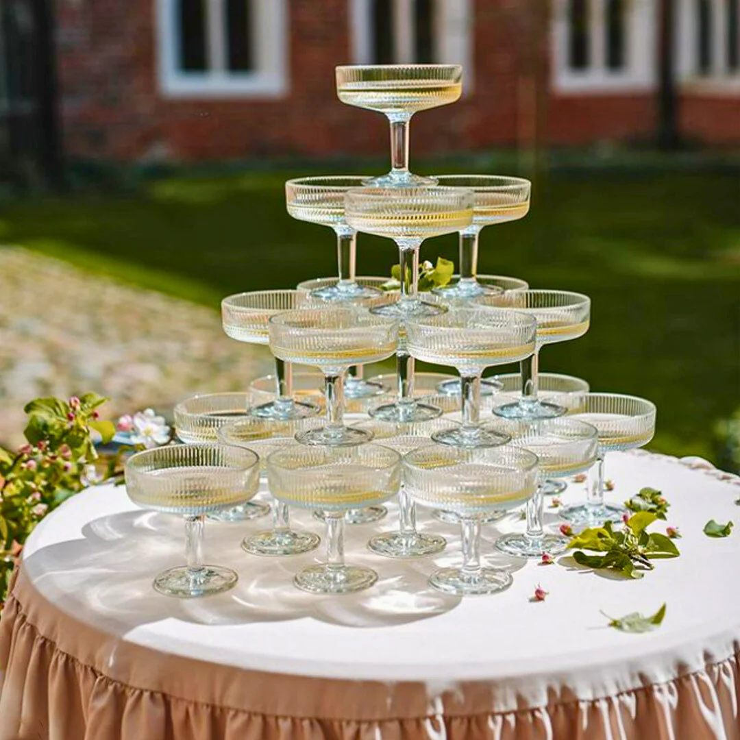 A pear set on a yellow plate upon a soft white canvas texture.